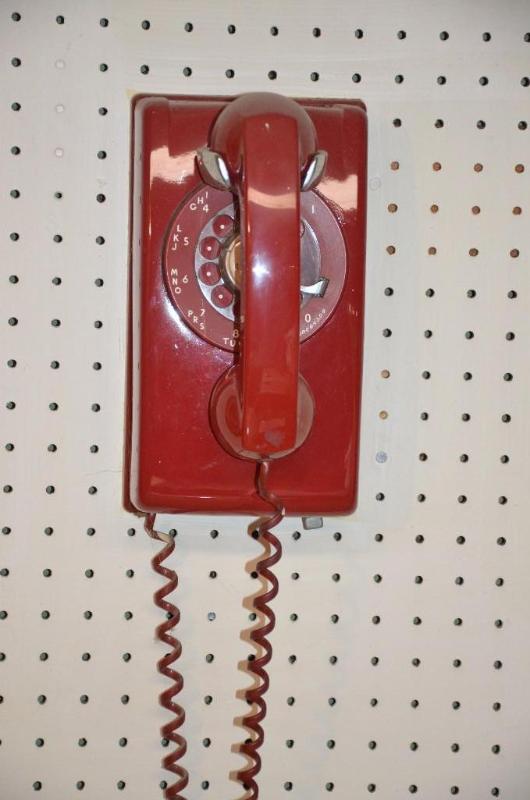 Vintage red rotary phone, wall mount....