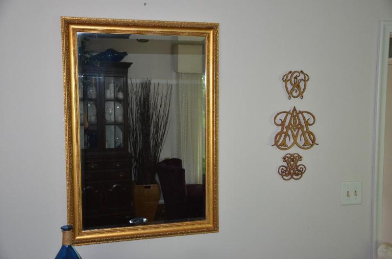 Mirror with three trivets. The trivets are th...