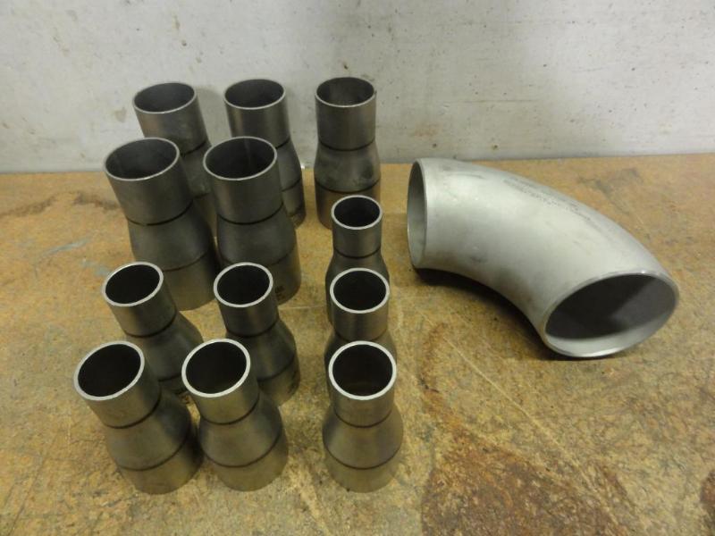 lot 112 image: Assorted Pipe Fittings to include TA Chen SAA403 SCH106 Stainless Steel Elbow 3-12 Diameter
