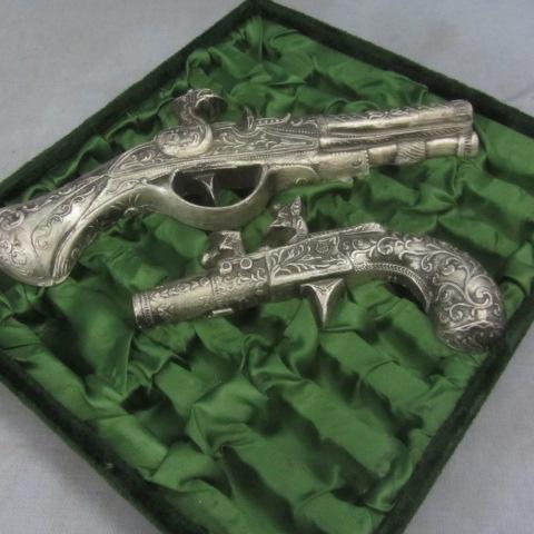 Framed Cast Pistols