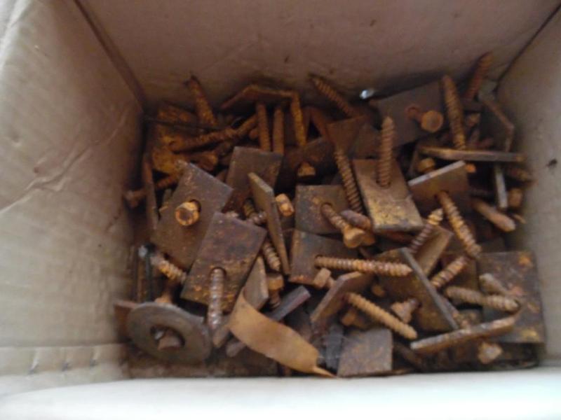 Box of Screws with Square Metal Pieces