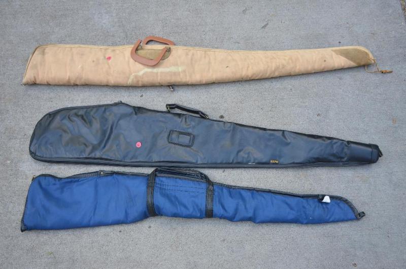 lot 128 image: 3 gun cases - Kolpin black case, blue case, t...
