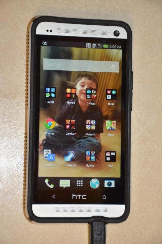 lot 13 image: HTC with Speck case - powers up, no power cor...