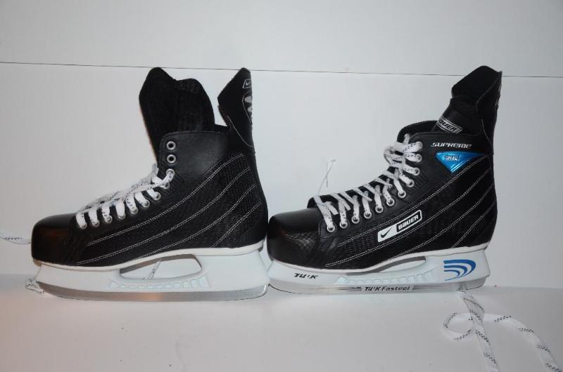 lot 86 image: Bauer ice skates size 12, appear unused...