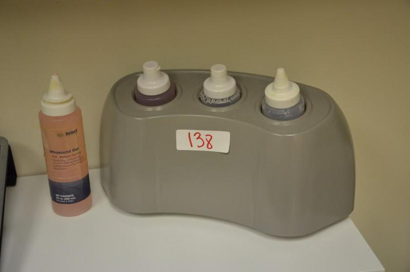 lot 138 image: Rich-Mar Gel and Lotion Warmer with 4 bottles...