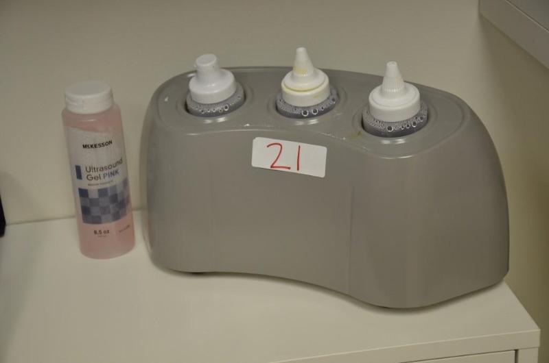 lot 21 image: Rich-Mar Gel and Lotion Warmer with 4 bottles...