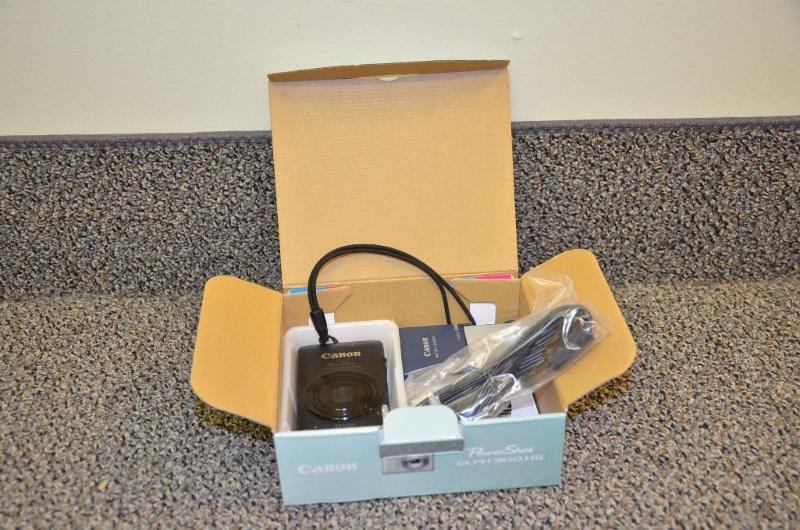 lot 71 image: Canon PowerShot ELPH 100 HS cameras with batt...