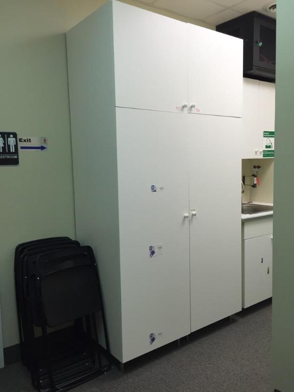 lot 97 image: White IKEA Cabinet. 24x25x93 tall. There are ...