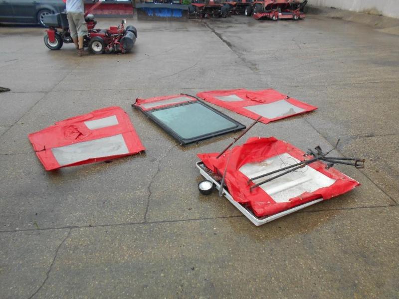 lot 9 image: Riding Mower Cab. Possibly Exmark Lazer Z.