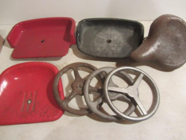 lot 135 image: Three Pedal Tractor Seats & Steering Wheels