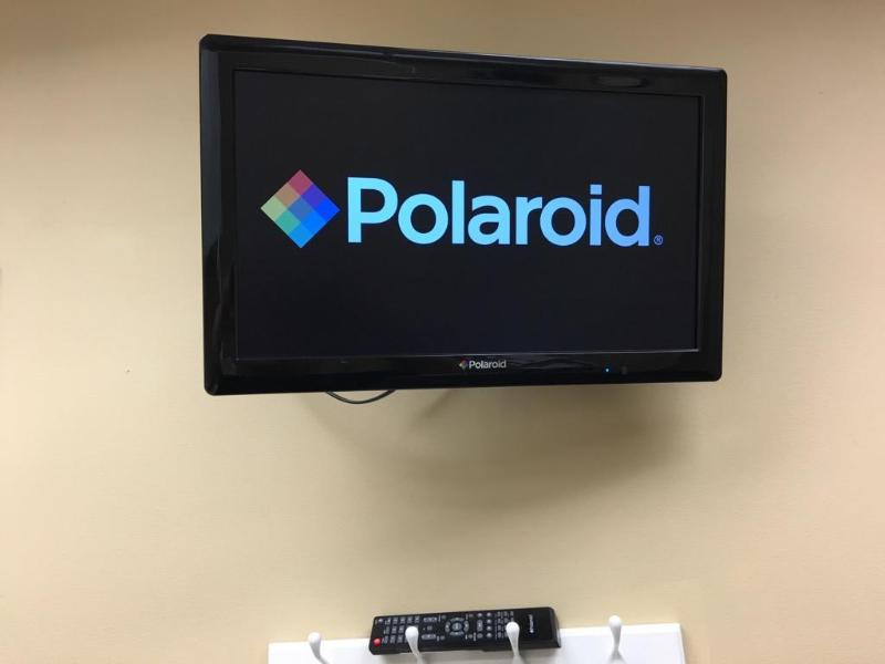 lot 12 image: Polaroid TV with remote control 24"...