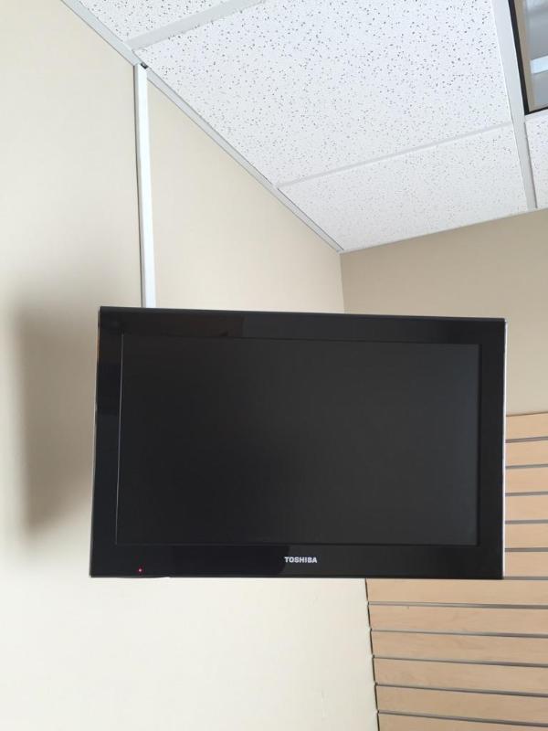 lot 58 image: 18" Wall mounted Toshiba TV...