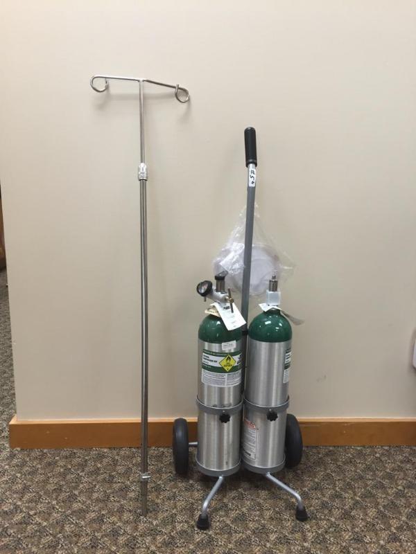 lot 5B image: Oxygen tank carrier and 2 oxygen tanks....