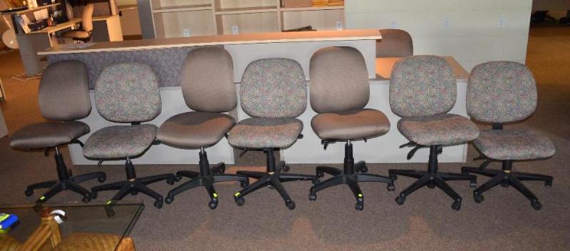 lot 115 image: Seven office chairs. Four are matching fabric...