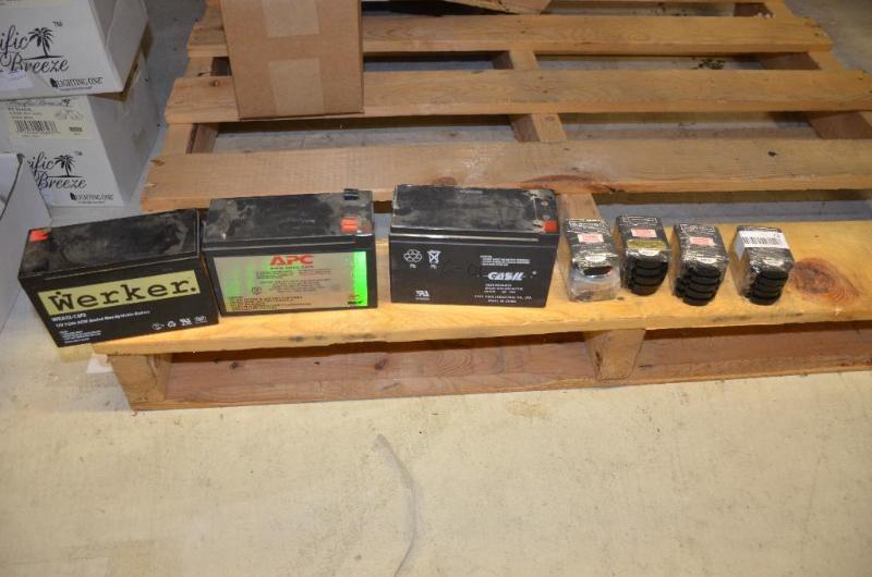 lot 72 image: 3 large batteries and 24 Motorola batteries...