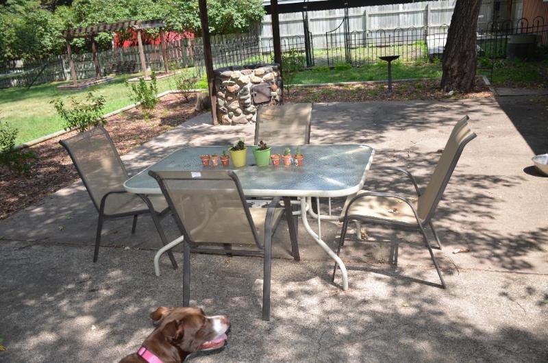 Patio table with glass top and 4 chairs. 38x6...