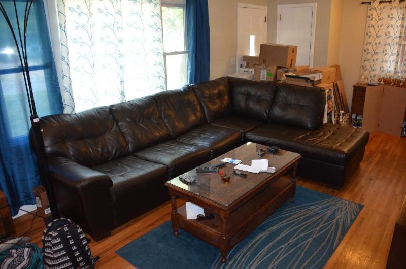 Fabique coffee colored leather-like sectional...