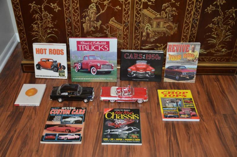 Two metal die cast model cars, and car books....