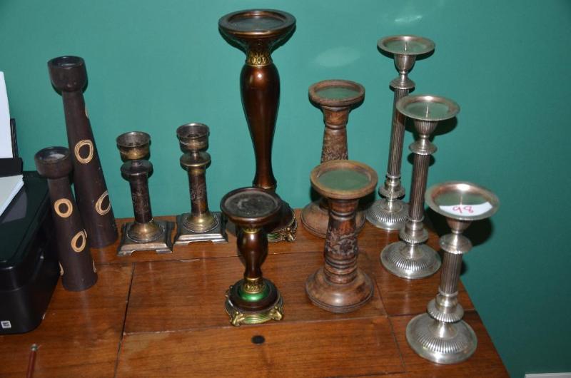 Metal and wood candle holders, the tallest is...