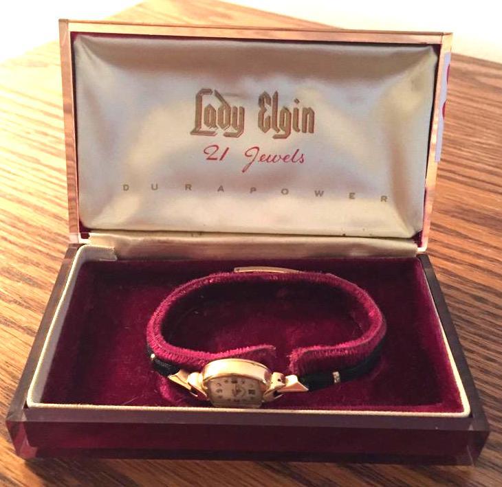 lot 36 image: 14K gold Lady Elgin Durapower watch in origin...