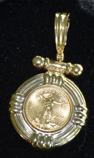 lot 109 image: 14k Gold pendant and we think a gold coin ins...