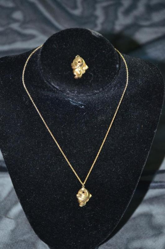 lot 110 image: Two 14k necklace pendants and one 10k gold ne...