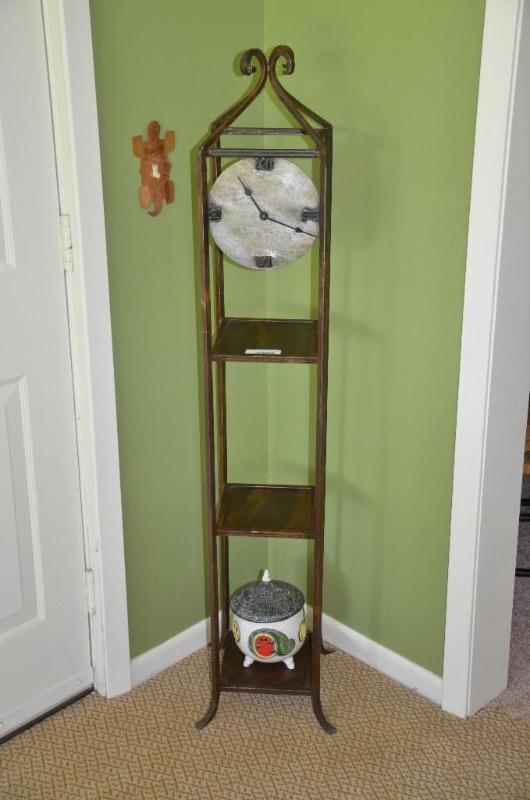 lot 131 image: Metal shelf with contents and built in clock ...
