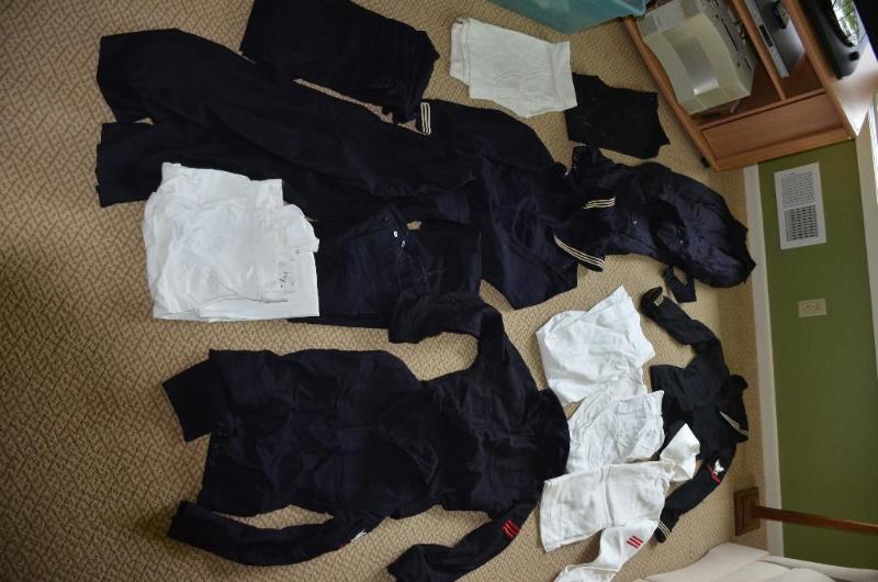 lot 202 image: Navy Uniforms Vietnam era shirts, pants, coat...