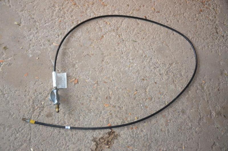 lot 219 image: Propane gas tank hose ten feet long...