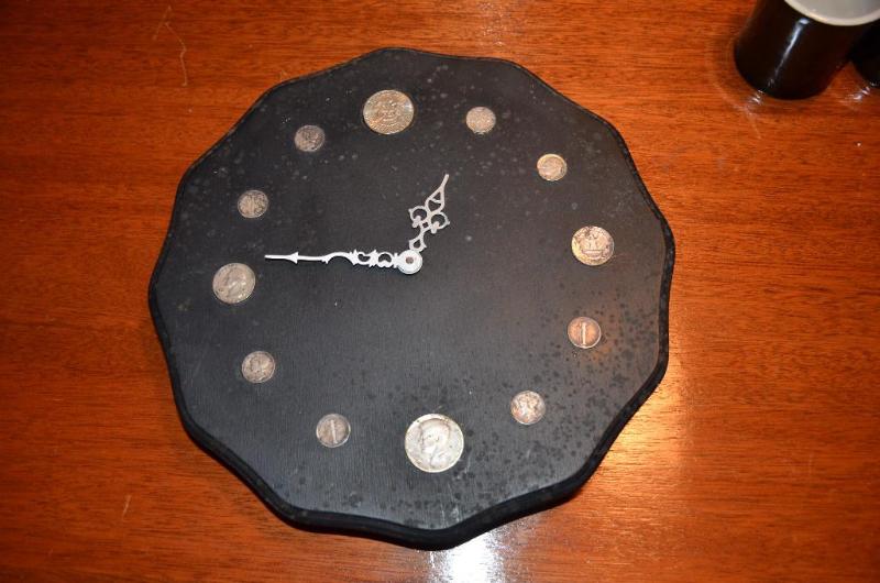 lot 251 image: Wooden clock with coins 12" diameter...