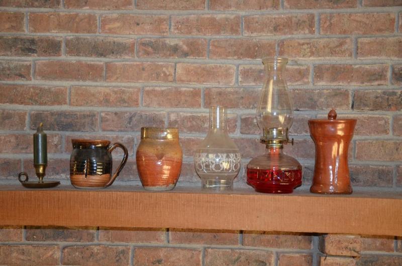lot 101 image: Kerosene lamp, hand made pottery...