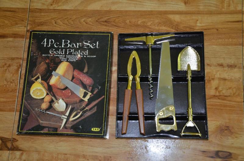 lot 105 image: 4 piece bar set , gold plated of construction...