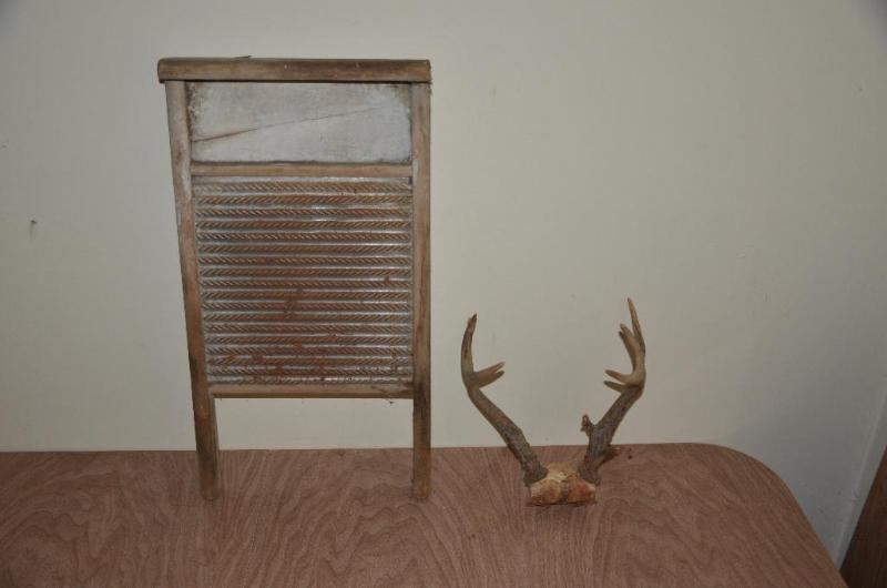 lot 125 image: Deer antlers and antique wash board...