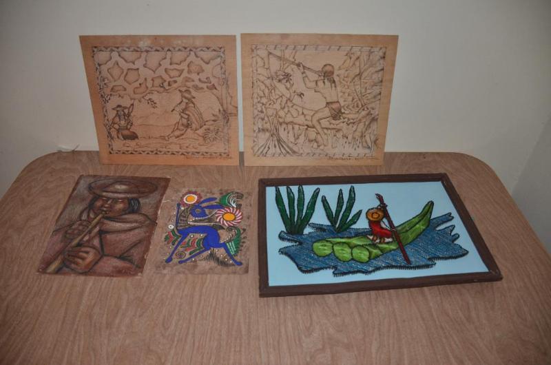 lot 151 image: Original art from Ecuador. Two wood burned sc...