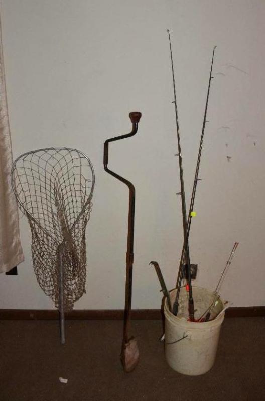 lot 169 image: Ice fishing gear and two fishing poles, net, ...