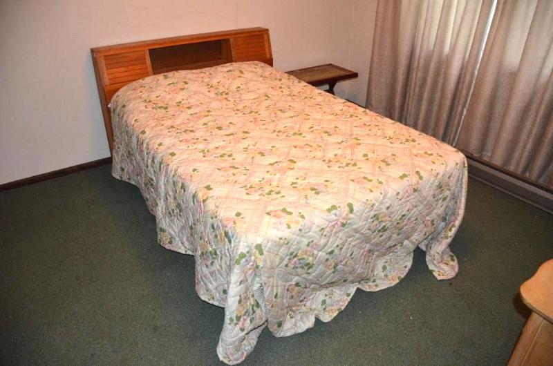 lot 27 image: Two beds with wood head boards 56" wide,...