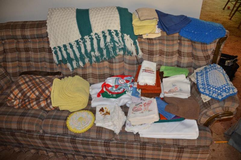 lot 91 image: Blankets, towels, hot pads, Wooden & plas...