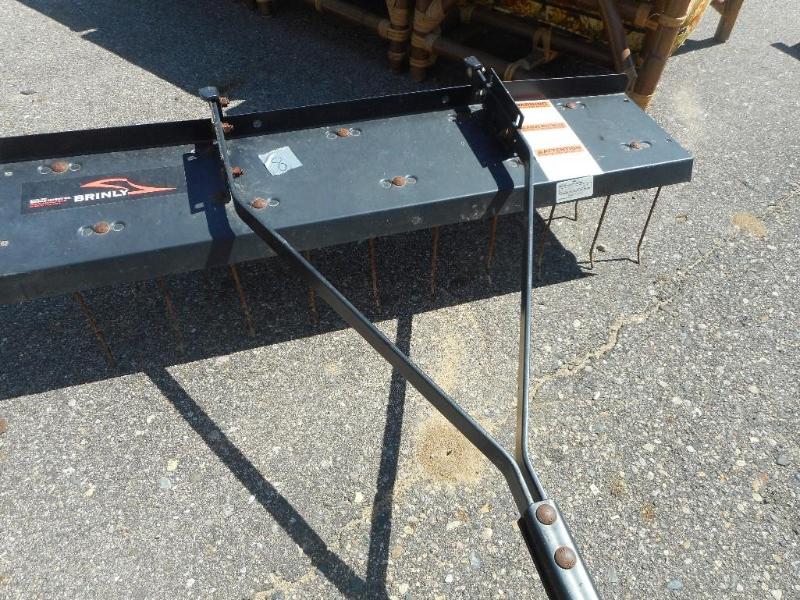 Lawn tractor aerator attachment