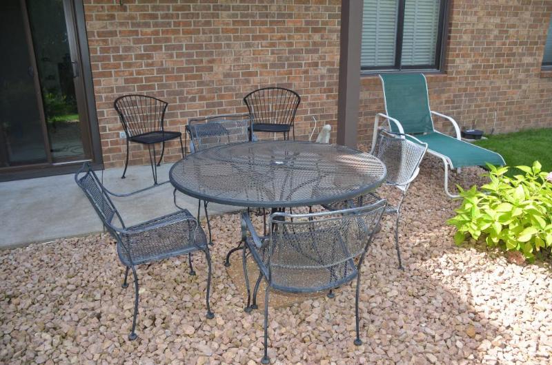 lot 12 image: Patio table 48" diameter & 6 chairs ...