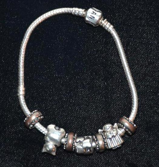 lot 1A image: PANDORA Sterling silver charm bracelet- These...