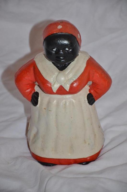 lot 234 image: Antique cast iron bank 8" tall...