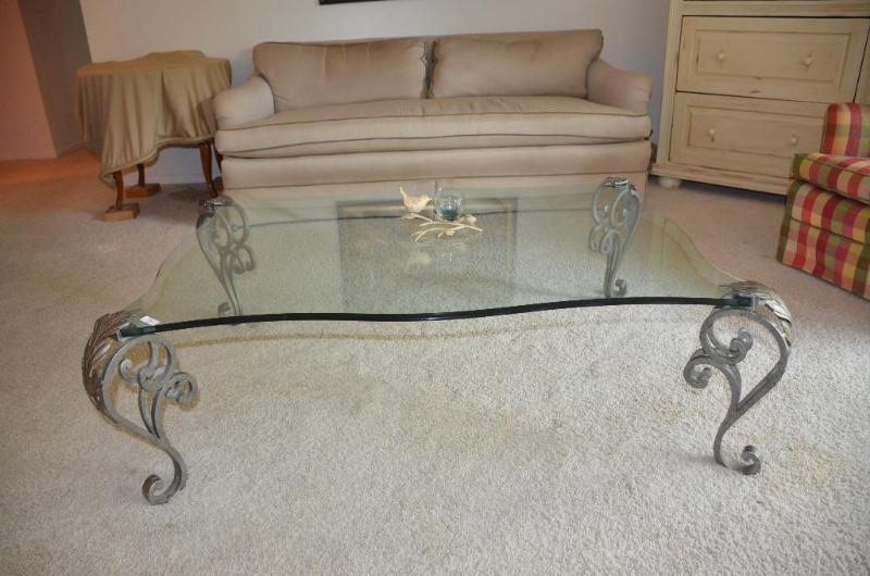 lot 7 image: Beautiful glass top coffee table with decorat...