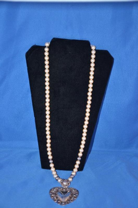 lot 72 image: Necklace with sterling silver pendant...