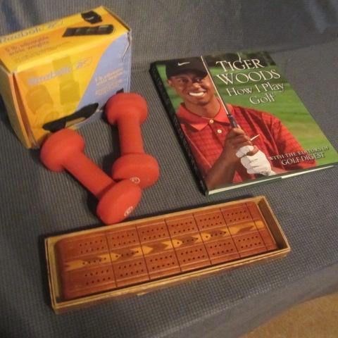 lot 139 image: Tiger Woods Golf Book, Weights