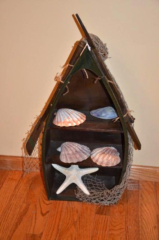 lot 10 image: Boat shaped shelf 27" tall with contents...