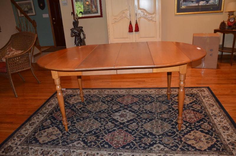lot 12 image: Wooden drop leaf table with 2 leafs, each lea...