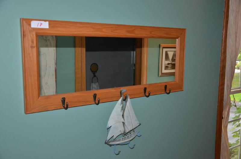 lot 18 image: Wood framed mirror with coat hooks 36x14"...