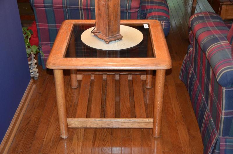 lot 56 image: Wooden end table with glass top and lower woo...