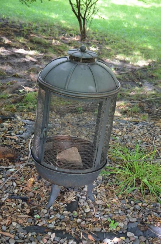 lot 63 image: Metal outdoor fire pit 36" tall....