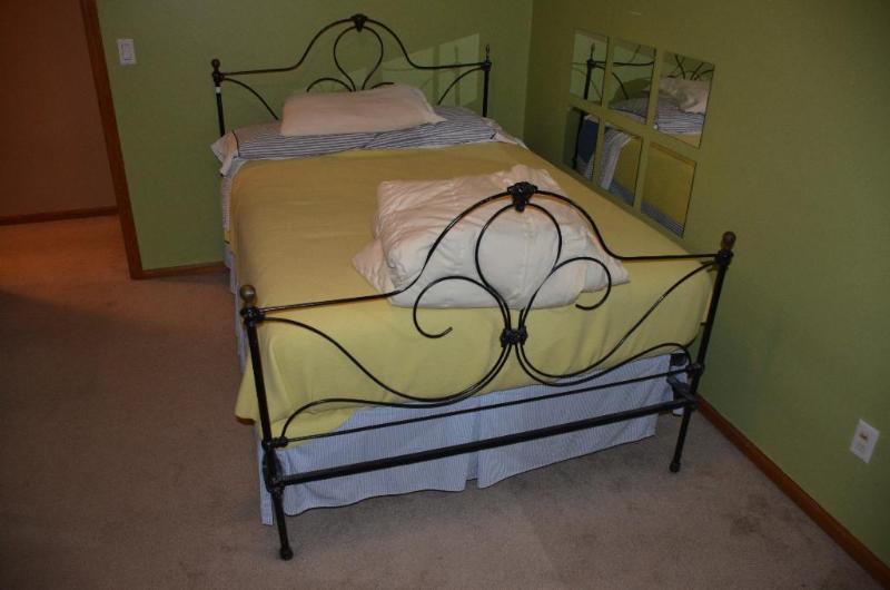 lot 69 image: Iron frame bed 54" wide , head board is ...